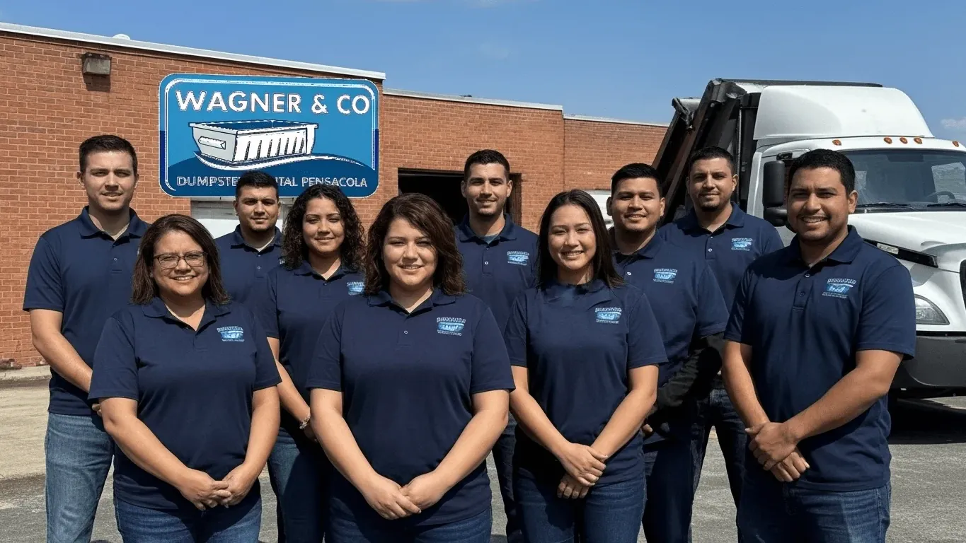Wagner & Co Dumpster Rental crew beside a roll-off truck loaded with a 15 yard container in Pensacola, FL Wagner & Co Dumpster Rental crew beside a roll-off truck loaded with a 15 yard container in Pensacola, FL